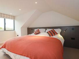 A bedroom with a bed and window at Harberton