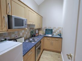 A kitchen with cabinets and appliances at The Hayloft near Wigton