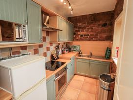 A kitchen with a sink and countertop at The Coach House near Wigton