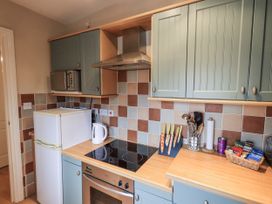 A kitchen with appliances and utensils at The Coach House near Wigton