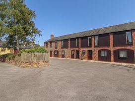 An exterior view of buildings with windows and doors at The Coach House near Wigton