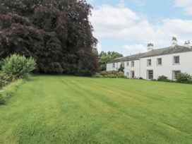 A house with a large tree and lawn at Westward Park near Wigton