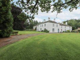 A house with lawn and trees at Westward Park in Westward near Wigton