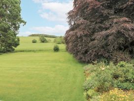 A garden with grass and trees at Westward Park, Westward near Wigton