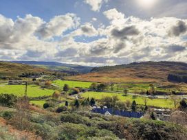 A landscape view of fields and hills at Waterfall Retreat in Blaenau Ffestiniog