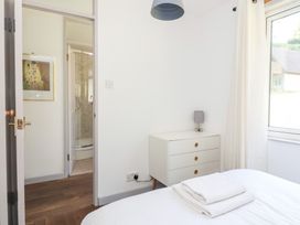 A bedroom with a bed and a chest of drawers at Valley Lodge 37, St Ann's Chapel, Cornwall
