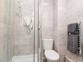 A bathroom with a shower and toilet at Valley Lodge 37 St Ann's Chapel Cornwall