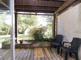 An outdoor area with chairs and plants at Valley Lodge 37 St Ann's Chapel, Cornwall