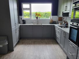 A kitchen with a window and sink at Beech Lodge in Foulksmills, County Wexford