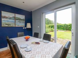 A dining room with a table set for tea at Beech Lodge, Foulksmills, County Wexford
