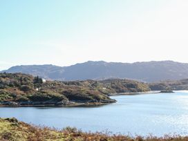 A coastal landscape with water and hills in the background at Creag Mhor Lodge Back of Keppoch near Arisaig