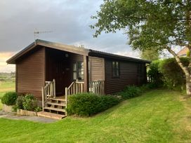 A cabin with steps and windows at Island View Lodge Back of Keppoch near Arisaig