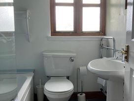A bathroom with a toilet and wash basin at Island View Lodge near Back of Keppoch