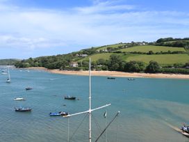 A beach view with boats on the water at 43 The Salcombe in Salcombe