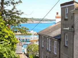 A view of the harbor and buildings at Kittiwake in Newlyn