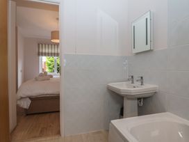 A bathroom with sink and toilet at Newton Calm in Newton Ferrers