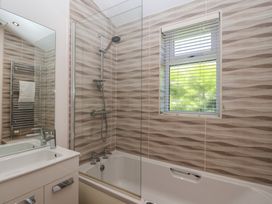 A bathroom with a bathtub and shower at Skyview in Newton Ferrers