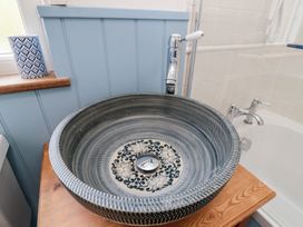 A sink with faucet in a bathroom at Sunny Side in Runswick Bay