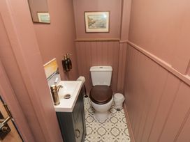 A bathroom with a toilet and sink at Sunny Side Runswick Bay