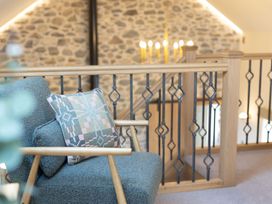 A landing with a chair and a cushion at Golygfa Cwrt near Bontgoch and Penrhyncoch
