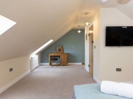 An attic room with a desk and chair at Golygfa Cwrt Near Bontgoch and Penrhyncoch