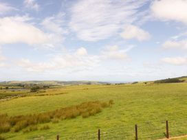 A grassy landscape with hills and clouds at Golygfa Cwrt Near Bontgoch and Penrhyncoch