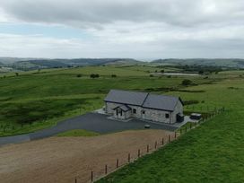 A stone house surrounded by fields near Bontgoch and Penrhyncoch