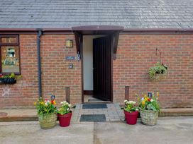 An entrance with flower planters at Daisy Cottage in Whitchurch Canonicorum near Charmouth