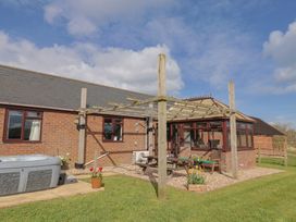 A house with a hot tub and garden area at Daisy Cottage Whitchurch Canonicorum near Charmouth