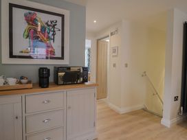 A kitchen with a coffee maker and microwave at Flat 2 The Cedars in Lyme Regis