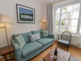 A living room with a sofa and table at Ty Clyd in Newport, Pembrokeshire