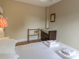 A bedroom with a bed and towels on it at Ty Clyd in Newport, Pembrokeshire