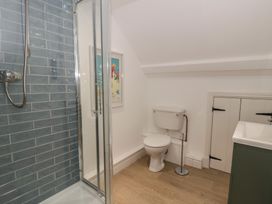 A bathroom with a shower and toilet at Ty Clyd in Newport, Pembrokeshire