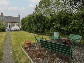 A garden with seating and plants at Ty Clyd in Newport, Pembrokeshire