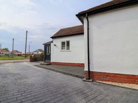 An exterior view of a house with a driveway at Driftwood in Rhyl