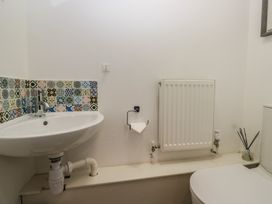A bathroom with a sink and a toilet at Highfield Cottage in Windermere