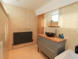 A bathroom with a sink and vanity unit at Highfield Cottage in Windermere