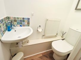 A bathroom with sink and toilet at Highfield Cottage in Windermere