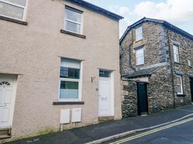An outdoor view of two buildings with windows and doors at Havelock Hideaway in Windermere