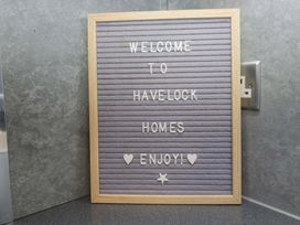 A letter board with welcome messages at Havelock Hideaway in Windermere