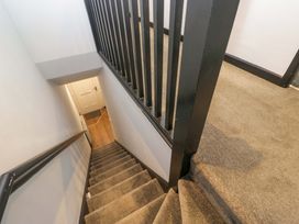 Staircase with stairs and railings at Havelock Hideaway in Windermere