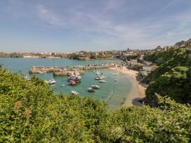 A coastal view with boats in the harbor at Lazy Days St Merryn