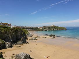 A beach view with sea and cliffs at Lazy Days in St Merryn