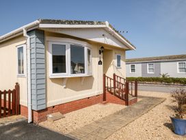 A house exterior with a pathway and steps at Lazy Days in St Merryn