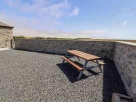 A picnic table on gravel in an outdoor area at West Burton Hemmel in Bamburgh