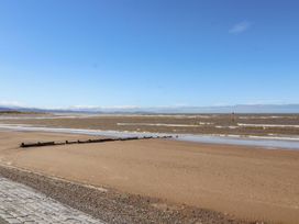 A beach with sand and water at Mount House in Bryniau near Dyserth