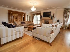 A living room with sofas and a coffee table at Mount House in Bryniau near Dyserth