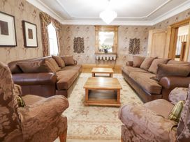 A living room with sofas and a coffee table at Mount House in Bryniau near Dyserth