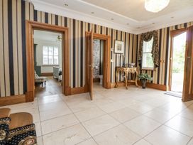 A hallway with doors leading to other rooms at Mount House in Bryniau near Dyserth