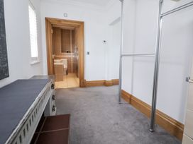 A bathroom with a toilet and wash basin at Mount House Bryniau near Dyserth